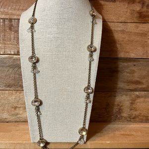 Gold tone necklace with clear crystal stones